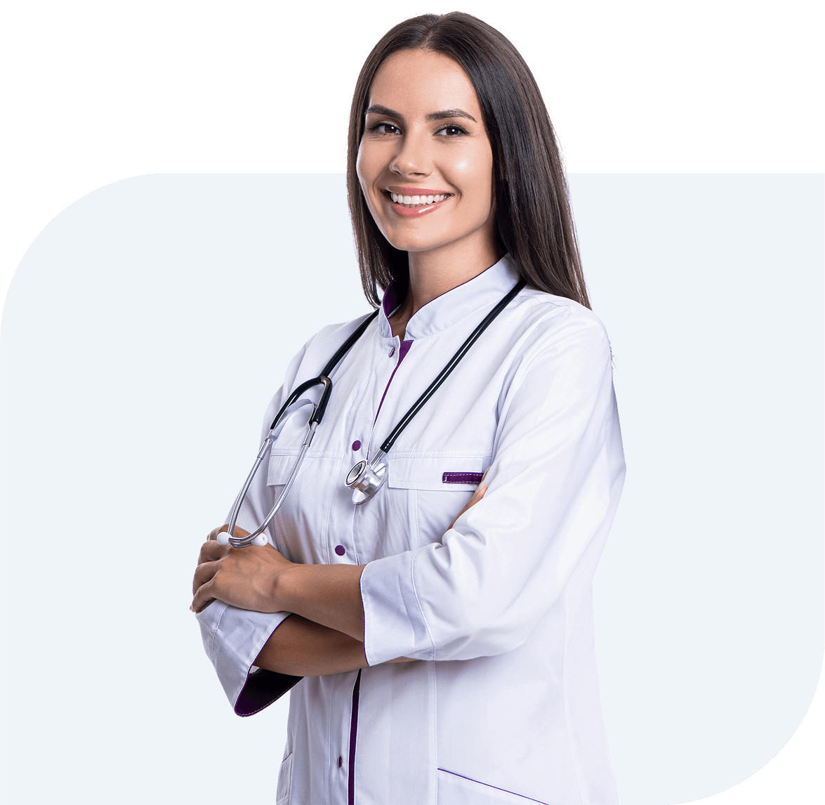 Group 1321317416 (1) A woman in a white lab coat with a stethoscope around her neck smiles confidently with her arms crossed.